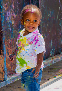 Teacher guiding kids through creative art project